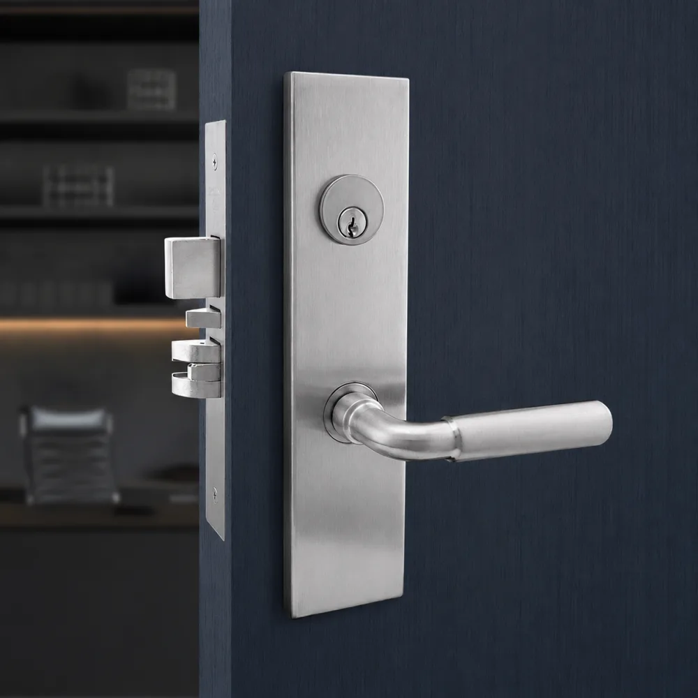 Brushed nickel mortise lockset with lever handle and deadbolt cylinder on a dark door