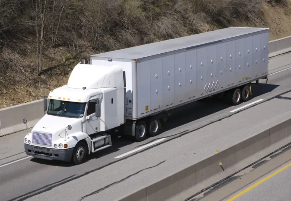 White American semi truck on a highway, representing trucks and large vehicles J&M unlocks
