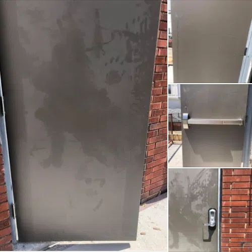 New commercial hollow metal door with crash bar and keypad lock installed on brick building